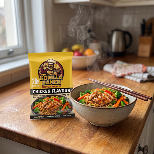 Gorilla Ramen chicken flavour pack with steaming bowl of noodles on kitchen counter